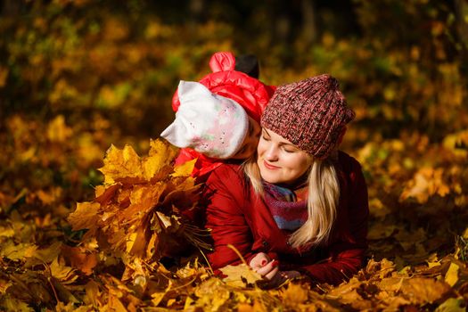 Mother daughter time. Soft focus shot of a mother and daughter together relaxing near the autumn park