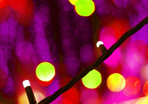 Bokeh lights background. Holiday illumination at night in close-up.