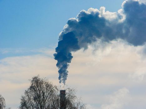 Heavy industrial pollution. Smoking factory chimney, Smoke pollution of the environment.