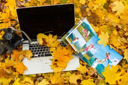 elegant photobook and laptop, autumn photo album