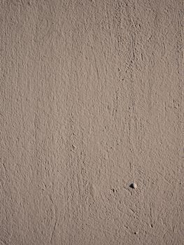 Old peeling paint on the wall..Brown abstract background..Beautiful brown textured stucco on the wall..Background from brown stucco..Background from brown stucco.