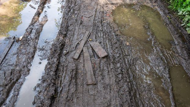 A neglected country road. Impassable broken dirt roads outside the city.