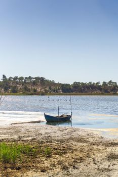 Vintage wooden boat on the river on a sunny day