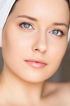 Skin care and beauty routine, beautiful woman with white towel wrapped around head, skincare cosmetics and face cosmetology, close-up portrait