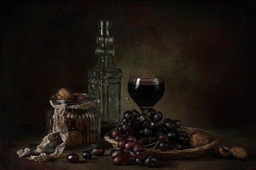 still life of berries and fruits on the table on a dark background photo