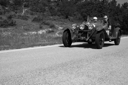 URBINO - ITALY - JUN 16 - 2022 : ALFA ROMEO 6C 1750 GRAN SPORT CARR. SPORT 1930 on an old racing car in rally Mille Miglia 2022 the famous italian historical race (1927-1957