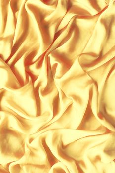 Luxury golden silk background texture - elegant fabric textures, abstract backgrounds and modern pastel colours concept