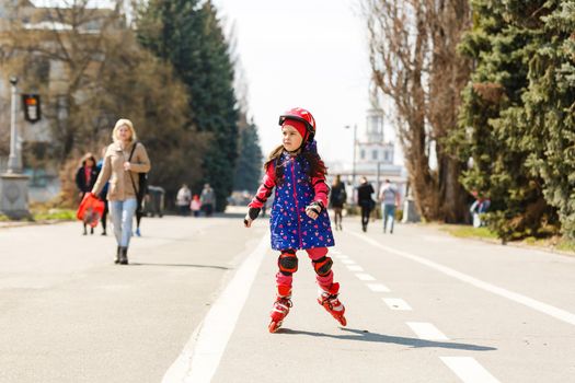 Young happy skater trying exciting outdoor activity