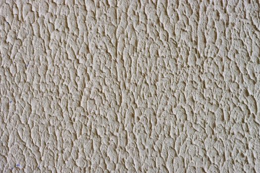 concrete wall background. Embossed uneven rough surface.