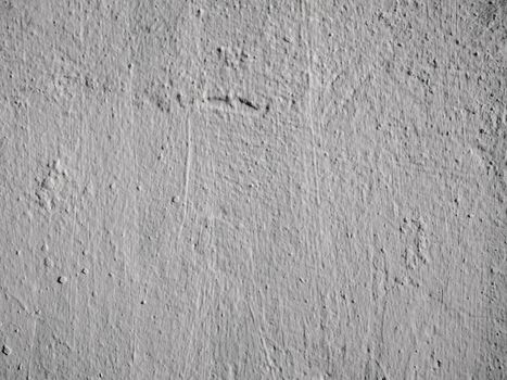 Old peeling paint on the wall..Beautiful gray textured stucco on the wall..Background from gray stucco.