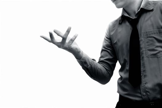 A too-young businessman wearing a blue colored shirt and a black tie isolated on white and Trying to expresses his doubtfulness by some hand gesture. Isolated on white.