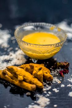 Gram flour or chickpea flour well mixed with turmeric using rose water in a glass bowl and making gram flour face mask for maintaining the pH of the skin.