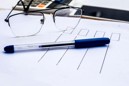 Close up of workplace of businessman or finance consultant isolated on white using credit card, cell phone, pen and calculator like things.