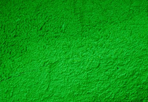 Abstract green texture from old stucco on the wall. Texture of falling green stucco.