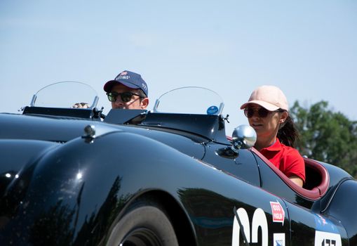 URBINO - ITALY - JUN 16 - 2022 : JAGUAR XK120 OTS ROADSTER 1950 on an old racing car in rally Mille Miglia 2022 the famous italian historical race (1927-1957