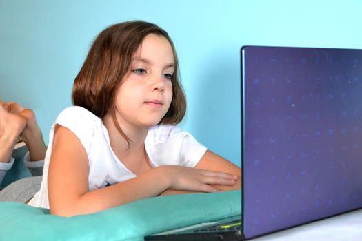 Girl student online learning class study online video call zoom teacher, Happy girl learn english language online with laptop at home. New normal. Social distancing. stay home . High quality photo