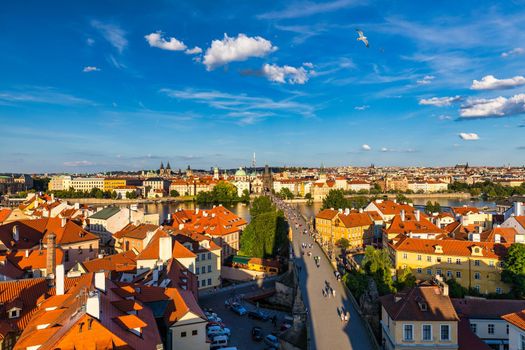 Old town of Prague. Czech Republic over river Vltava with Charles Bridge on skyline. Prague panorama landscape view with red roofs.  Prague view from Petrin Hill, Prague, Czechia.