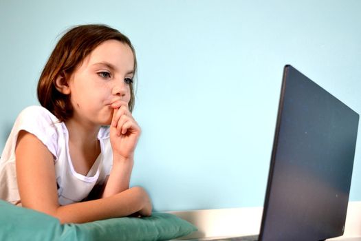Girl student online learning class study online video call zoom teacher, Happy girl learn english language online with laptop at home. New normal. Social distancing. stay home . High quality photo