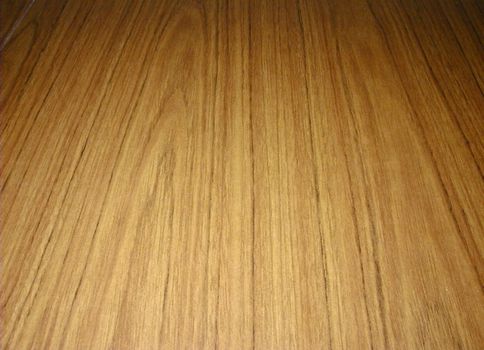 faux wood surface on a sheet of laminate particleboard wood