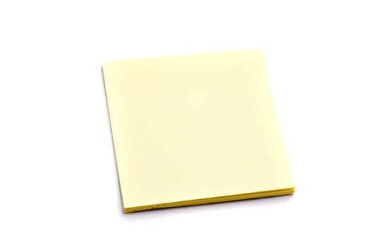 Block of yellow paper notes on white background