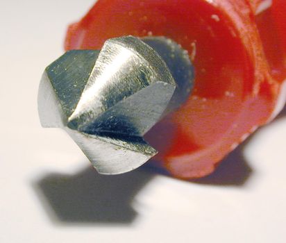 Woodworking hand countersink tool for inserting screws flush with the surface of the wood in a close up on the end of the bit