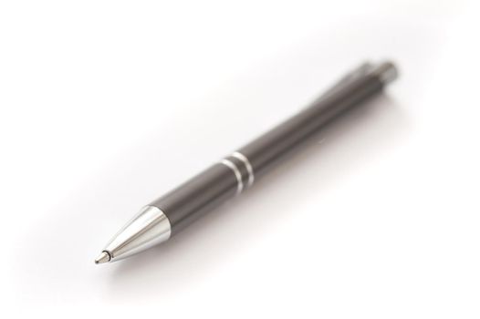 Close up Single Black Ballpoint Pen or Biro Isolated on White Background