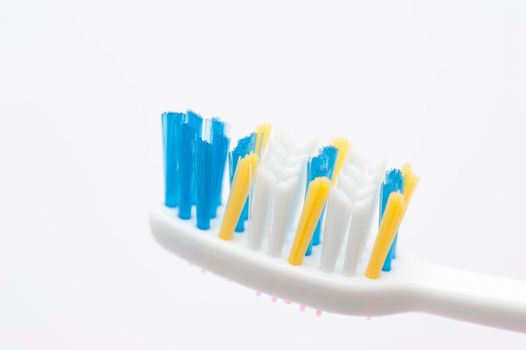 close up view of toothbrush bristles on white background