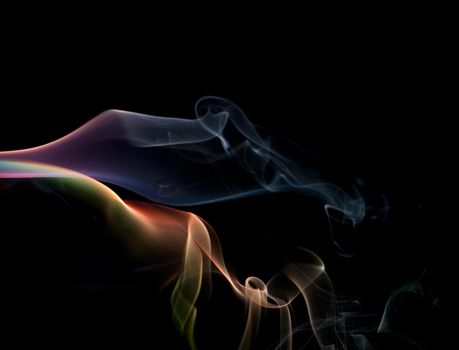 a colorful cloud of smoke vapour on black