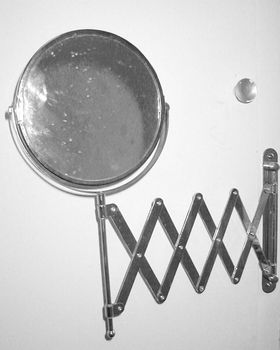 a traditional extendable bathroom shaving mirror