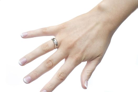 a girls hand wearing a platinum wedding rings
