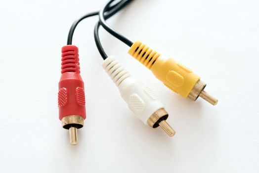 Three red, yellow and white RCA audio cables with plugs or jacks for video sound