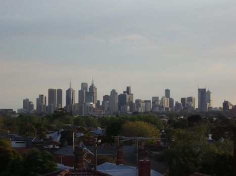 view of melbourne CBD across rooftops in the suburbs
