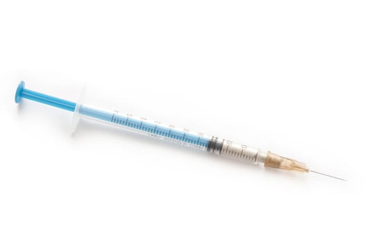 Small disposable syringe and needle for subcutaneous or intramuscular application of liquid medication such as insulin in chronic diabetes, isolated on white