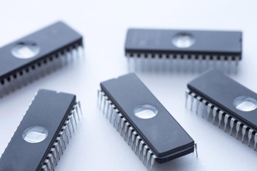 Black integrated circuit memory chips EEPROM on white surface background