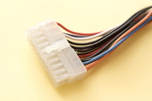 Molex PSU ATX power connector close-up on yellow background