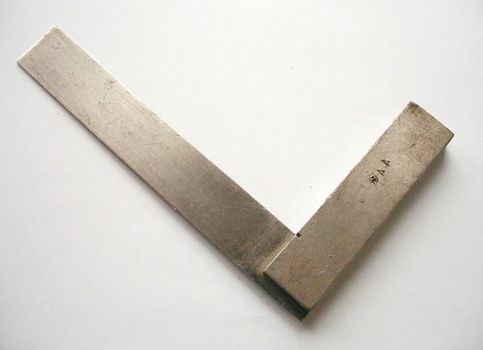 Set square or right angle for use in building to ensure a perpendicular angle lying diagonally on a white background