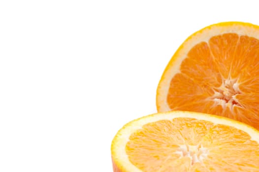 Closeup of the juicy pulp of a halved fresh orange isolated on white with copyspace