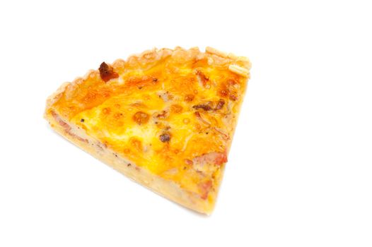 Slice of tasty golden fresh savoury egg quiche isolated on a white background