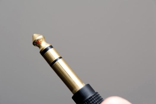 an audio jack plug or TRS connector 6.35mm or 1/4" jack
