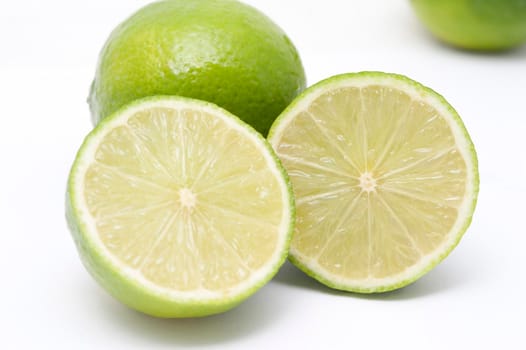 Fresh halved lime arranged to display the juicy pulp with its tangy acidic flavour used as a garnish and seasoning in cooking