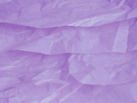 Background texture of soft crinkled or crumpled soft tissue paper in a lilac color, full frame