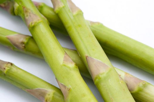 Close up of fresh green asparagus shoots used as an ingredient and vegetable in cookery