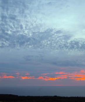 dusk sky glowing red with a fiery sunset