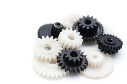 Close up Black and White Plastic Cog Gears Isolated on White Background.