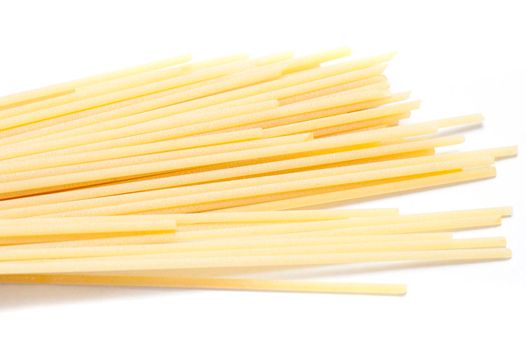 Uncooked Italian spaghetti pasta made from healthy durum wheat and used as an ingredient in Mediterranean cuisine
