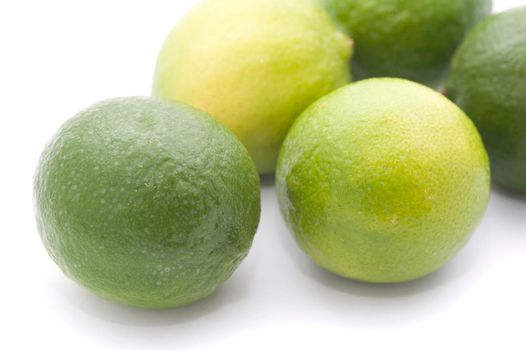 Nutritious fresh and green limes on white background, close-up