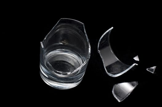 Close up Shot of Conceptual Broken Glass Isolated on Black Background