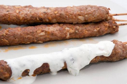 Kofta kebabs made from spiced minced lamb served with a yoghurt sauce