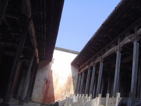 Angled Abstract Architectural Detail of Chinese Palatial Architecture in Forbidden City with Slice of Blue Sky with Shining Sun, Beijing, China