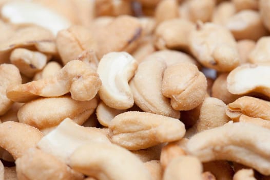 Close up view with shallow dof of fresh roasted cashew nuts served as an appetizer or snack